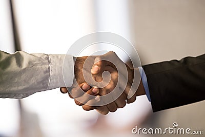 Close up of male employees handshake closing deal Stock Photo