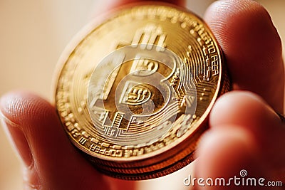 Close up of male hand holding Bitcoin Stock Photo