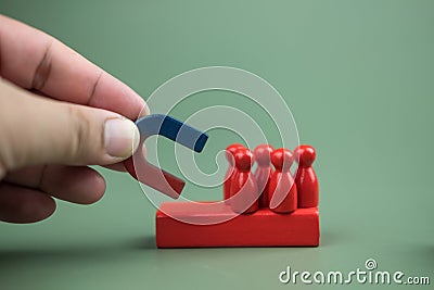 Close up of male hand holding horseshoe magnet picked the best and unique person to organization Stock Photo