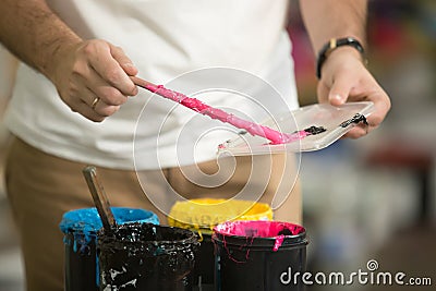 Close up of male hands combining CMYK Stock Photo