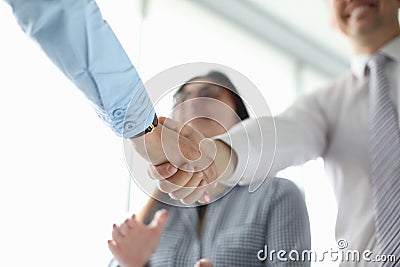 Biz partners shaking hands Stock Photo
