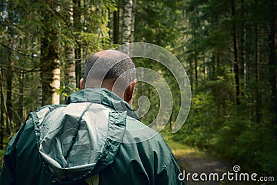 Criminal and suspicious person in the forest. Stock Photo