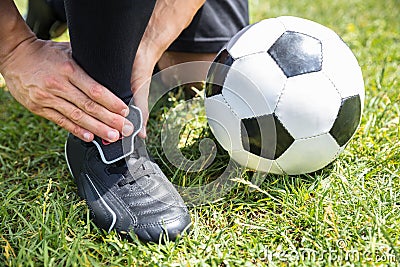 Male Soccer Player Suffering From Ankle Injury Stock Photo