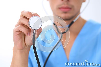 Close-up of male surgeon doctor using stethoscope , focus on stethoscope Stock Photo