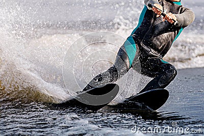 close-up man athlete riding waterskiing on lake Stock Photo