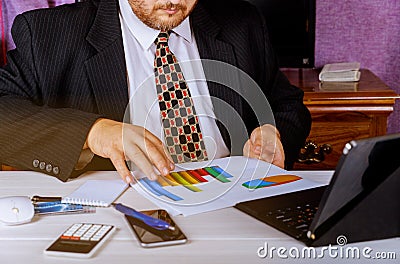 savings, finances, economy and home concept close up of man with calculator counting money and making notes at home Stock Photo