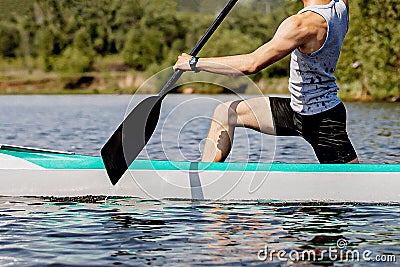 close-up man canoeist on canoe single rowing Stock Photo