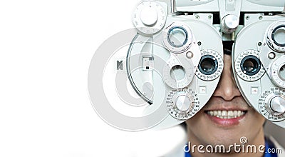 Close-up Of a man Doing Eye Test On Phoropter, Male checking on her eye with optometry machine. copy space background for text Stock Photo