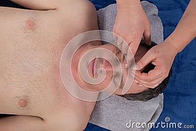 Close-up of a man getting acupuncture treatment Stock Photo