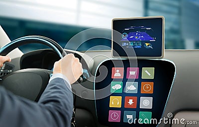 Close up of man with gps on tablet pc driving car Stock Photo