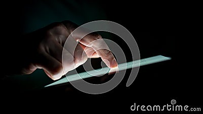 Close up Man Hand Touching a Touch Screen Device Stock Photo