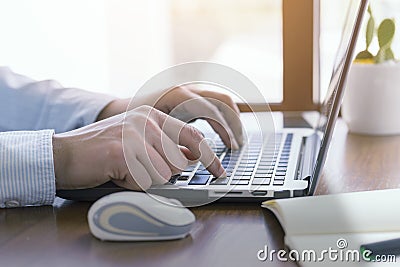 Close up, Man hands using computer laptop, working outside Stock Photo