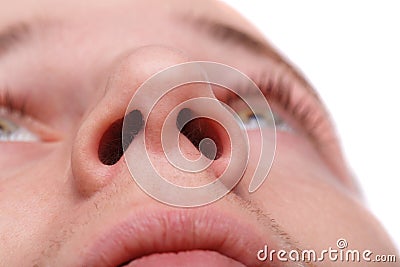 Close-up of a man showing his nostrils. Isolated over white background Stock Photo