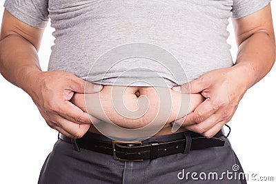Close-up of man holding unhealthy big belly visceral subcutaneous fats Stock Photo