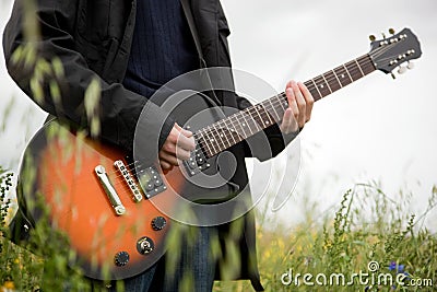 Close up of a man playing guitar Stock Photo