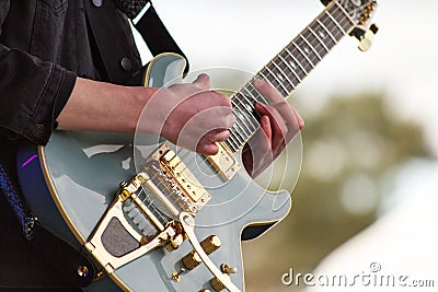 Close up of man playing a guitar Stock Photo