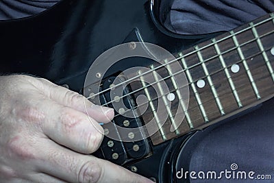 Close-up of man playing lead guitar solo Stock Photo