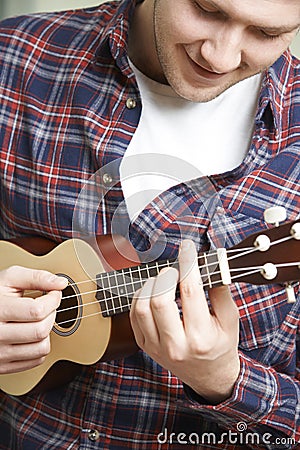 Close Up Of Man Playing Ukulele Stock Photo