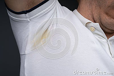 Yellow Sweating Very Badly Under Man`s Armpit Stock Photo