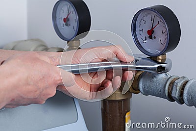 Close-up of man's hands with wrench Stock Photo