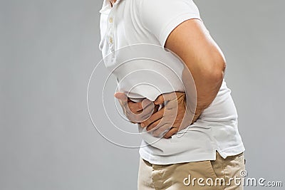 Close up of man suffering from stomach ache Stock Photo