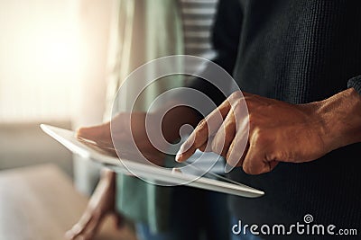 Close-up of a man touching on digital tablet Stock Photo