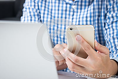 Close up. Man who wear blue shirts are using phones for online shopping. Stock Photo