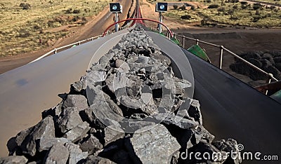 Close up of Manganese rock on a conveyor belt Stock Photo