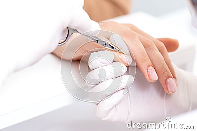 Close up of manicurist using manicure scissors Stock Photo