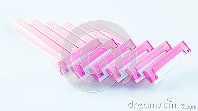 Lots of pink ladies shavers in a row. Stock Photo