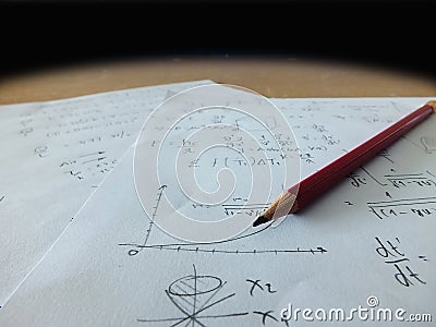 Close up mathematical equations on a sheet of paper Stock Photo
