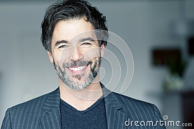 Close Up Of A Mature Man Smiling Stock Photo