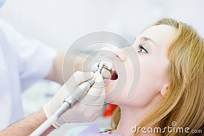 Close-up medical dentist procedure of teeth polish Stock Photo