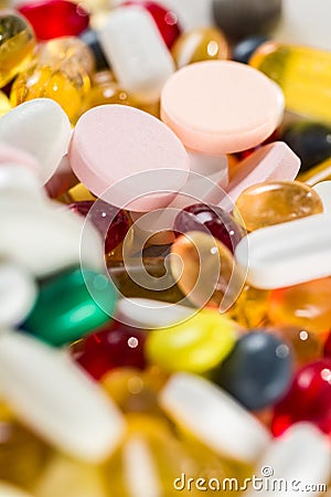 Close-up medicinal drugs, pills and capsules in capsules and tablets on white background. Stock Photo