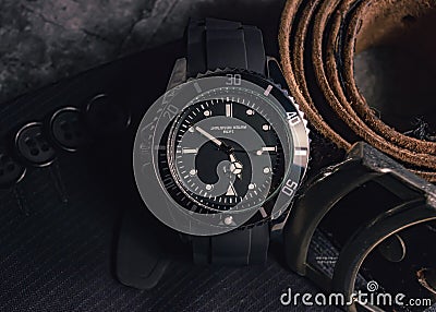 Close-up of a men's watch and leather belt. Stock Photo