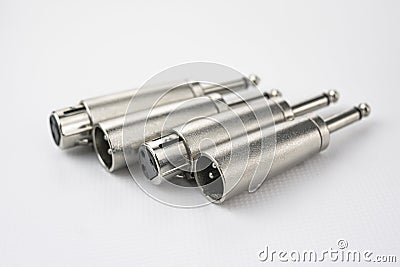 Close-up of metal male and female xlr audio converters to jack type, on white background Stock Photo