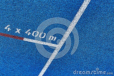 Close up of 400 meter sprint blue tracking field Stock Photo