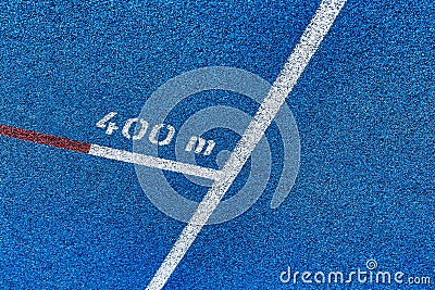 Close up of 400 meter sprint blue tracking field Stock Photo