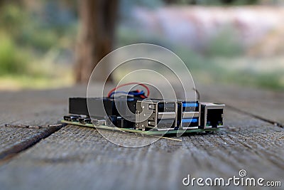 Close-up of a microcomputer for electrical engineering and programming prototyping on wood surface Stock Photo