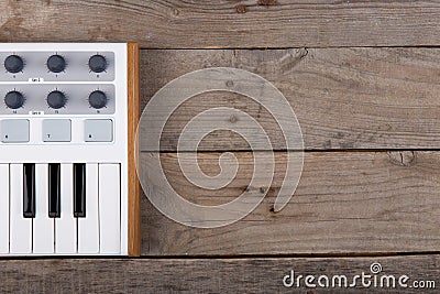 Close up of MIDI controller volume fader, knob and keys. Stock Photo