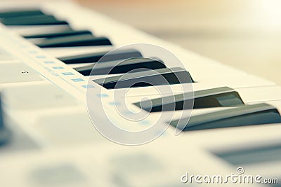Close up of MIDI controller volume fader, knob and keys. Stock Photo