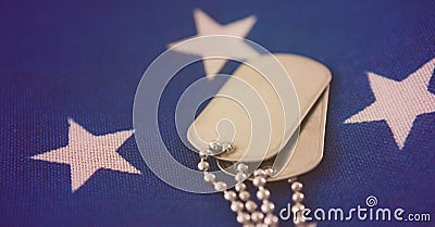 Close up of military dog tags american flag background with copy space Stock Photo