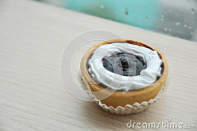 Close up mini blueberry tart on wood background Stock Photo