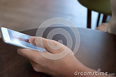 Close up mobile smart phone with blank screen on hands of unidentified people in coffee cafe. Stock Photo