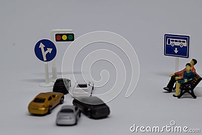 Close up model toy/miniature traffic jam and couple sitting for waiting a bus Stock Photo