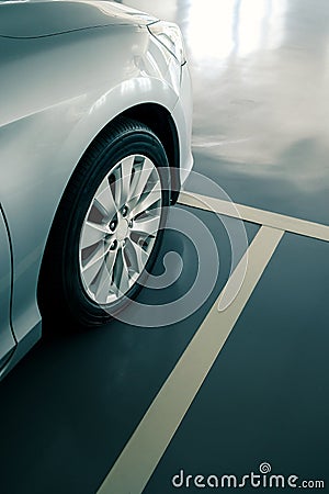 Close up of modern car in parking lot, anti slip coating floor for safety Stock Photo