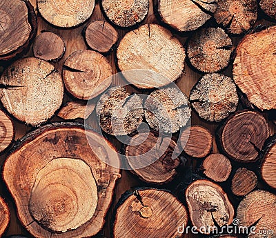 Close up modern creative decor wall with stacked wooden sawn logs Stock Photo