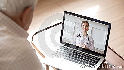 Elderly man having online video consultation with doctor Stock Photo