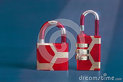 A close-up of a modern image of two vintage padlocks with a colorful original design on a studio background with copy space. Stock Photo