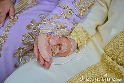 Close up of moroccon couple`s hands at a wedding, Stock Photo